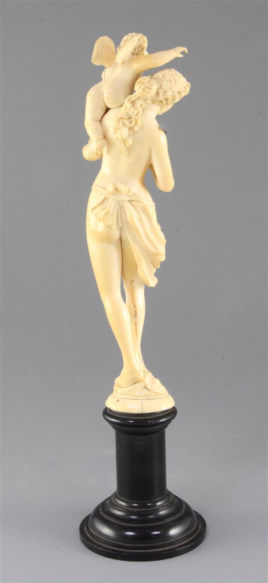 A 19th century French Dieppe ivory carving of Venus and Cupid, Overall H.13.25in.